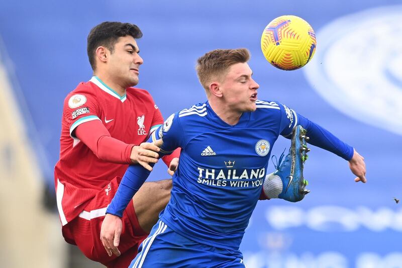 Liverpool's defender Ozan Kabak vies with Leicester City's midfielder Harvey Barnes. AFP