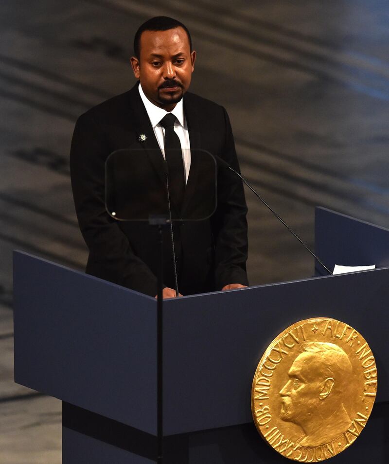 Ethiopia's Prime Minister and Nobel Peace Prize Laureate Abiy Ahmed Ali speaks after receiving the Nobel Peace Prize during a ceremony at the city hall in Oslo on December 10, 2019. Abiy Ahmed is picking up his Nobel Peace Prize in the Norwegian capital as ethnic violence is on the rise at home, festivities are being kept to the bare minimum and he has refused to speak to the media cancelling this years Nobel Peace Prize press conference. / AFP / Fredrik VARFJELL
