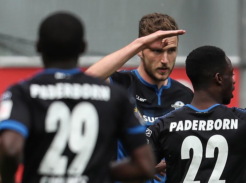 Dennis Srbeny (C) of SC Paderborn celebrates with teammates after scoring against Hoffenheim. EPA