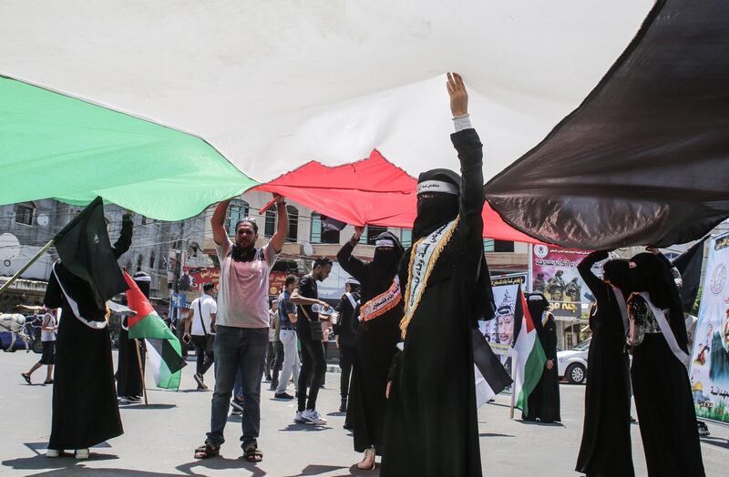 Palestinians rally against Israel's West Bank annexation plans, in Rafah in the southern Gaza Strip on June 29, 2020. / AFP / SAID KHATIB
