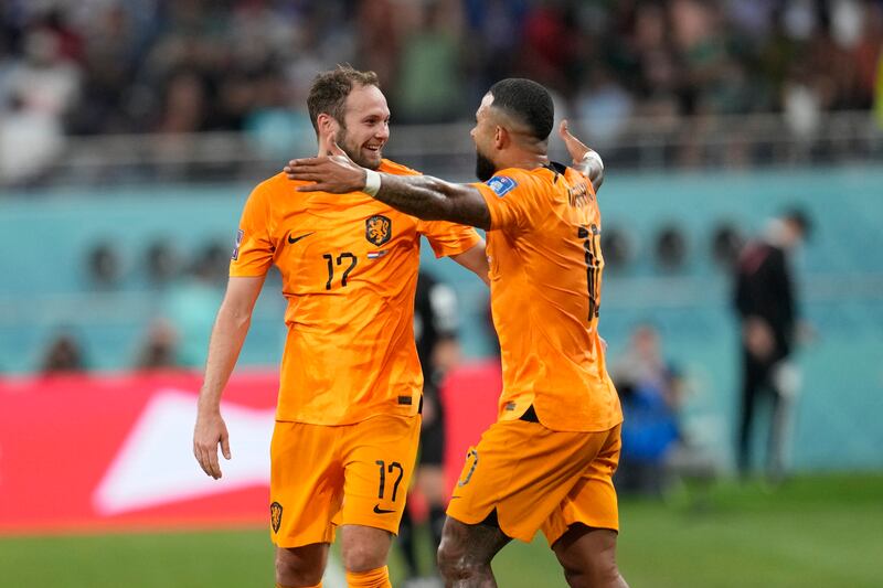 Daley Blind celebrates after scoring with Memphis Depay. AP