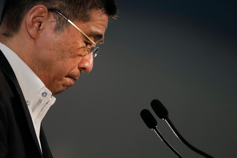 FILE - In this July 25, 2019, file, photo, Nissan CEO Hiroto Saikawa pauses for a moment during a news conference at the global headquarters in Yokohama, west of Tokyo. Saikawa has acknowledged receiving inappropriate payments from the Japanese automaker but has denied he ordered it or knew about it. (AP Photo/Jae C. Hong, File)