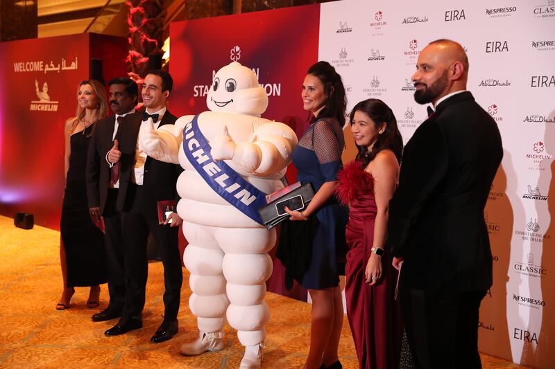 Guests with Bibendum, aka the Michelin Man, the group’s mascot. 