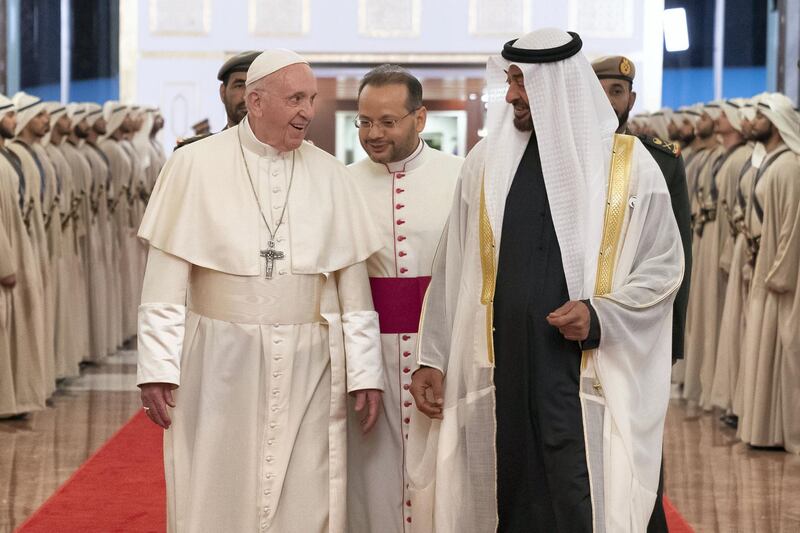 ABU DHABI, UNITED ARAB EMIRATES - February 3, 2019: Day one of the UAE Papal visit - HH Sheikh Mohamed bin Zayed Al Nahyan, Crown Prince of Abu Dhabi and Deputy Supreme Commander of the UAE Armed Forces (R), receives His Holiness Pope Francis, Head of the Catholic Church (L), at the Presidential Airport. 

( Ryan Carter / Ministry of Presidential Affairs )
---