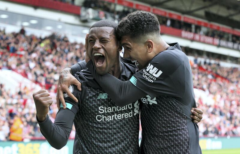Liverpool's Georginio Wijnaldum celebrates scoring his side's first goal of the game with team-mate Roberto Firmino during the Premier League match at Bramall Lane, Sheffield.