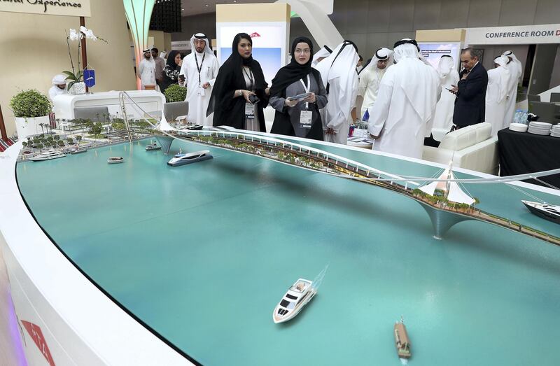 ABU DHABI,  UNITED ARAB EMIRATES , OCTOBER 6 – 2019 :- Delegates looking at the model of Dubai Sky Garden at the UAE stand during the 26th World Road Congress exhibition held at Abu Dhabi National Exhibition Center in Abu Dhabi. ( Pawan Singh / The National ) For News. Story by Patrick