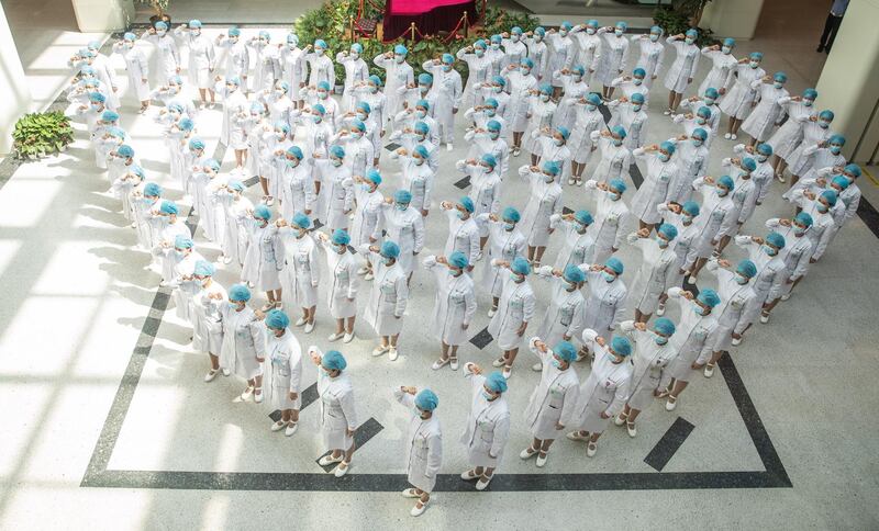 Chinese nurses recite an oath during a ceremony celebrating International Nurses Day at Tongji Hospital in Wuhan, Hubei province, China.  EPA