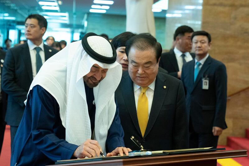 SEOUL, REPUBLIC OF KOREA (SOUTH KOREA)  - February 26, 2019: HH Sheikh Mohamed bin Zayed Al Nahyan, Crown Prince of Abu Dhabi and Deputy Supreme Commander of the UAE Armed Forces (L), signs the visitors book upon arrival at the National Assembly Building of the Republic of Korea (South Korea). Seen with meets with HE Moon Hee-sang, Speaker of the National Assembly (R).

( Hamad Al Mansoori / Ministry of Presidential Affairs )
---