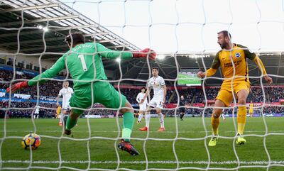 SWANSEA, WALES - NOVEMBER 04:  Glenn Murray of Brighton and Hove Albion beats Lukasz Fabianski of Swansea City as he scores his side's first goal during the Premier League match between Swansea City and Brighton and Hove Albion at Liberty Stadium on November 4, 2017 in Swansea, Wales.  (Photo by Michael Steele/Getty Images)