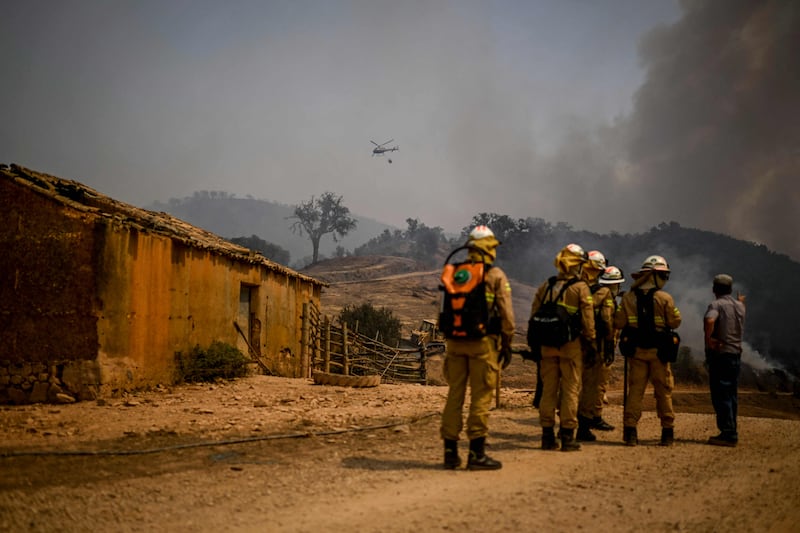 Firefighters arrive to battle a blaze in Reguengo, Portugal. AFP