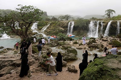 Locals and tourists tour the Wadi Darbat (Darbat Valley) near Salalah, in the southern Omani province of Dhofar.  AFP