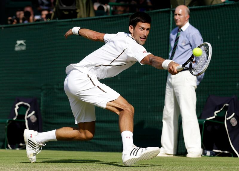 Novak Djokovic of Serbia plays a return to Andy Murray of Britain during the Men's singles final match at the All England Lawn Tennis Championships in Wimbledon, London, Sunday, July 7, 2013. (AP Photo/Anja Niedringhaus, Pool) *** Local Caption ***  Britain Wimbledon Tennis.JPEG-0c70f.jpg