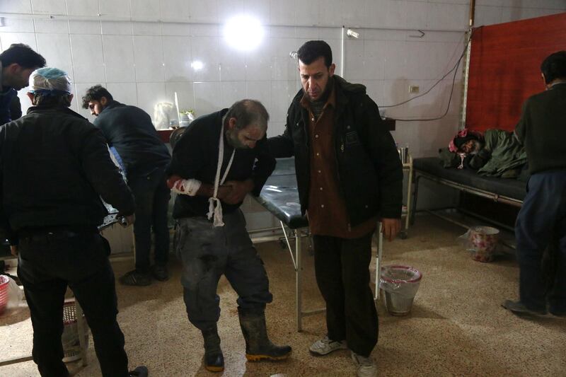 Wounded Syrians are seen as they wait to receive treatment at a make-shift hospital following Syrian government bombardments on the besieged rebel-held town of Hamouria in the eastern Ghouta region on the outskirts of the capital Damascus on March 3, 2018. Abdulmonam Eassa / AFP