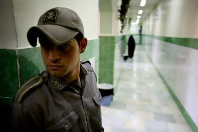 A guard stands along a corridor in Tehran's Evin prison. Reuters