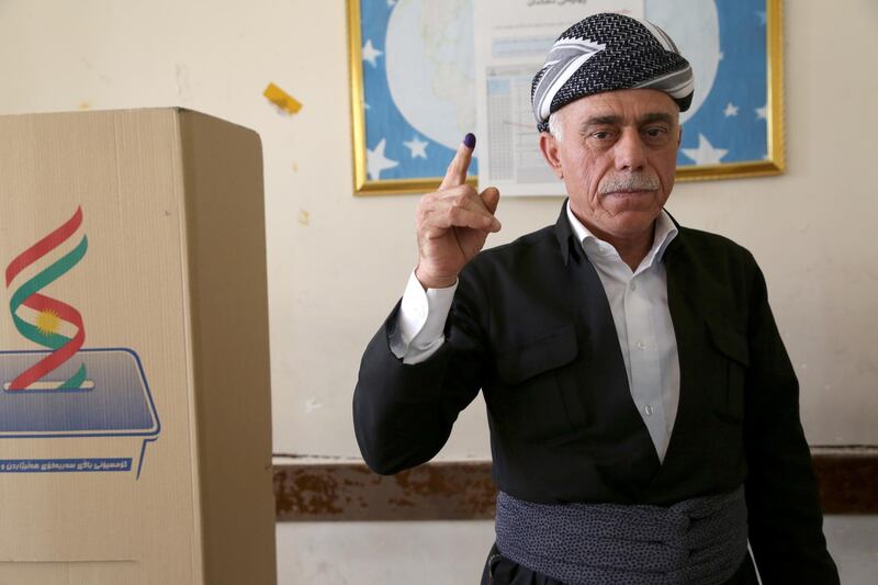 Kurdish man in traditional clothes show his ink-marked finger after casting his vote in the Kurdistan parliamentary election at a polling station in Erbil, the capital of the Kurdistan Region in Iraq. With over three million people eligible to vote, the semi-autonomous region is voting on its parliamentary elections a year after a failed bid for independence from Iraq.  EPA