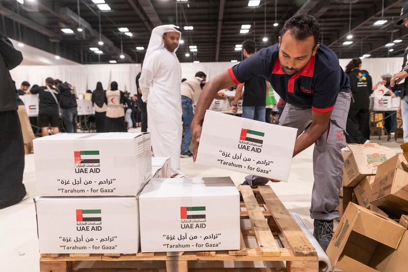 Packed boxes of aid for Gaza are stacked up in Al Rimal Hall, in Dubai.