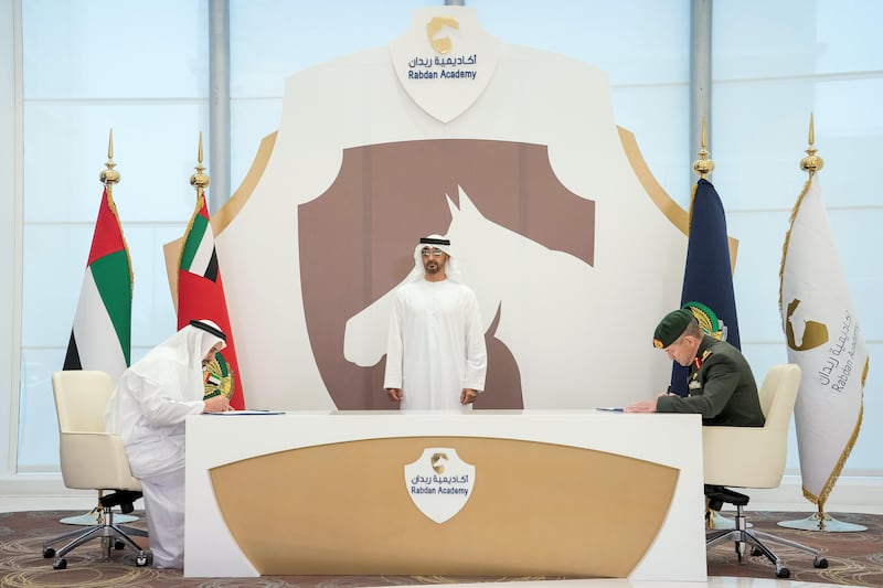 ABU DHABI, UNITED ARAB EMIRATES -September 20, 2017: HH Sheikh Mohamed bin Zayed Al Nahyan, Crown Prince of Abu Dhabi and Deputy Supreme Commander of the UAE Armed Forces (C), witnesses a MOU between Ministry of Defense and Rabdan Academy, signing on behalf of the Ministry of Defense, the Memorandum of Understanding  was signed by HE Matar Salem Al Dhaheri, Under-Secretary of the Interior Ministry (L) and on behalf Rabdan Academy, Major General Mike Hindmarsh, Chairman of the Board of Trustees of the Rabdan Academy (R).

( Rashed Al Mansoori / Crown Prince Court - Abu Dhabi )
---