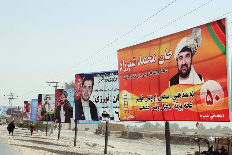 Election campaign posters are installed on a road side ahead of the upcoming Parliamentary elections, in Helmand, Afghanistan. The Taliban appealed to the people of Afghanistan to boycott the upcoming parliamentary elections in the country. EPA