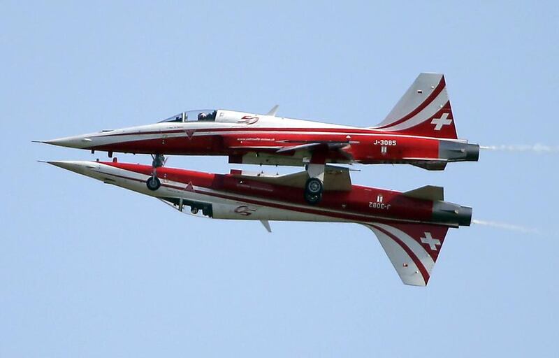 Two Northrop F-5E Tiger II airplanes of the Swiss Patrol fly close together during an aerobatic performance at the ILA Berlin Air Show in Berlin, Germany.  Michael Sohn / AP