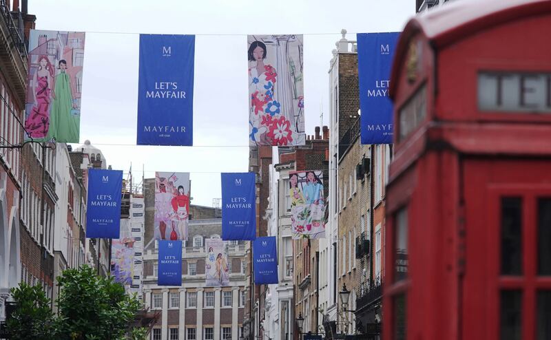 Flags designed by British fashion illustrator Anjelica Roselyn  on display across South Molton Street in Mayfair to celebrate the jubilee. PA