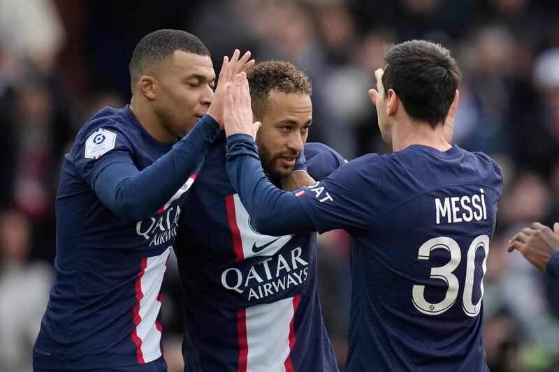 Neymar celebrates with teammates Kylian Mbappe and Lionel Messi after scoring PSG's second goal. AP