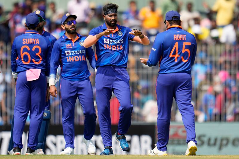 India's Hardik Pandya, second right, celebrates with teammates after the dismissal of Australia captain Steven Smith for a duck. AP