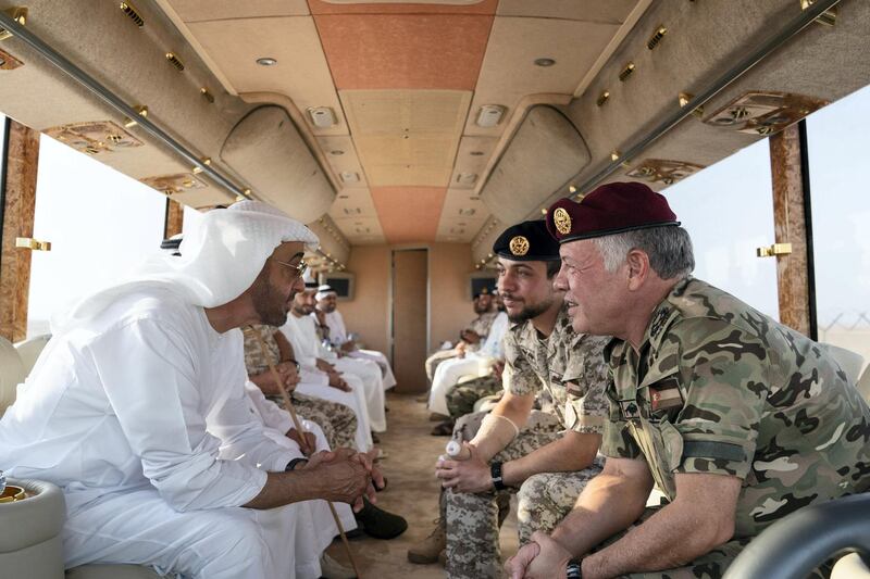 AL DHAFRA REGION, ABU DHABI, UNITED ARAB EMIRATES - June 26, 2019: HH Sheikh Mohamed bin Zayed Al Nahyan, Crown Prince of Abu Dhabi and Deputy Supreme Commander of the UAE Armed Forces (L), HM King Abdullah II, King of Jordan (R) and HRH Hussein bin Abdullah, Crown Prince of Jordan (2nd R), inspect military exercise sites during the UAE and Jordan joint military drill, Titled ‘Bonds of Strength’, at Al Hamra Camp.

( Mohamed Al Hammadi / Ministry of Presidential Affairs )
---
