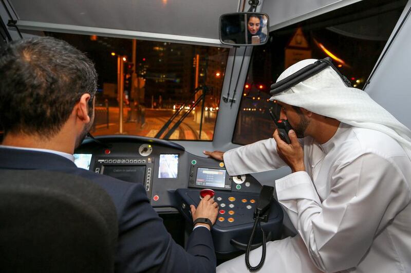 Sheikh Hamdan bin Mohammed, Crown Prince of Dubai, sitting with the driver of a Dubai Tram during the tram’s inauguration on November 11, 2014. Wam