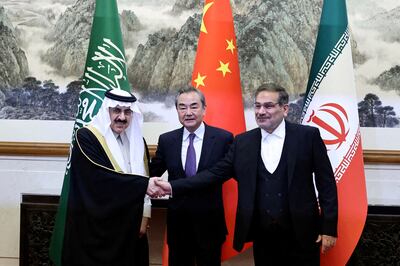 China's Wang Yi, flanked by Ali Shamkhani, secretary of Iran’s Supreme National Security Council, right, and Saudi Arabia's national security adviser Musaad Al Aiban in Beijing on March 10. Reuters
