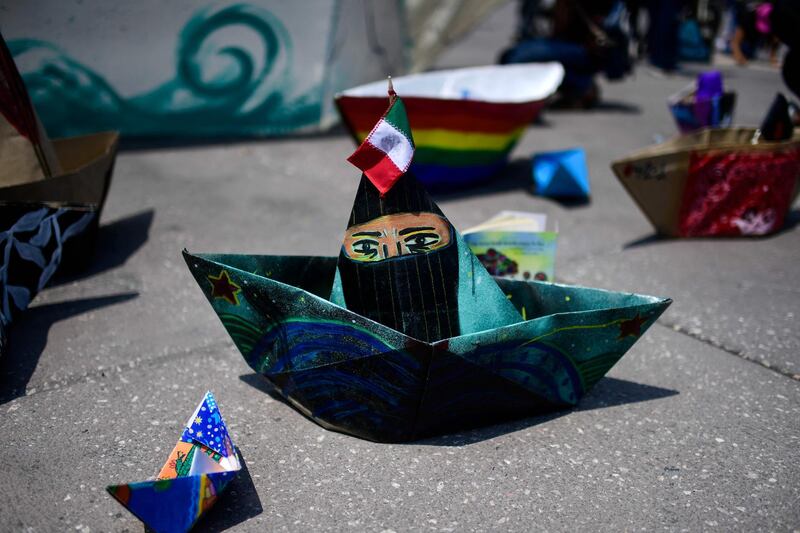 Paper boats at an event about a delegation of the Zapatista Army of National Liberation former guerrilla group, which will depart on the 'La Montana' ship for Europe to meet with anti-capitalist groups, at Zocalo square, in Mexico City. AFP