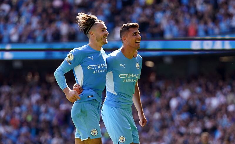 Rodri, right, celebrates scoring their City's fourth goal with Jack Grealish. PA