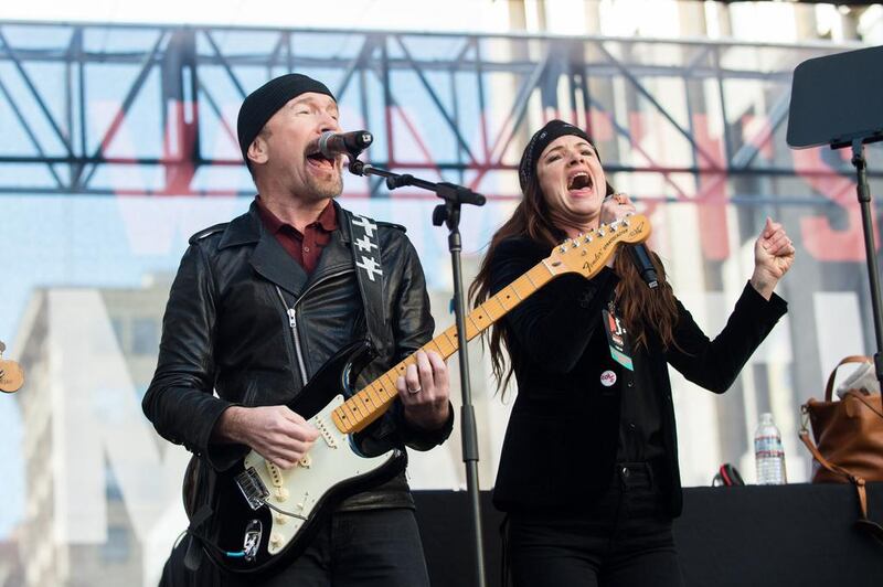 Musician The Edge, left, and Juliette Lewis perform onstage at the women’s march in Los Angeles on January 21, 2017 in Los Angeles, California. Emma McIntyre / Getty Images / AFP