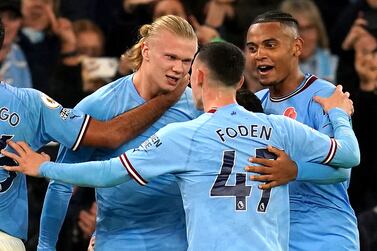 Manchester City's Erling Haaland (left) celebrates scoring their side's second goal of the game with team-mates Phil Foden and Manuel Akanji (right) during the Premier League match at the Etihad Stadium, Manchester. Picture date: Saturday November 5, 2022.
