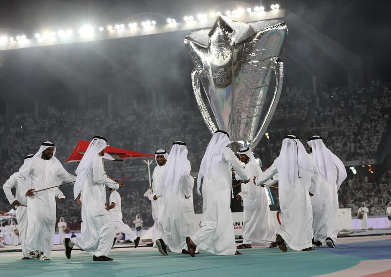 Men perform during the opening ceremony. AP Photo