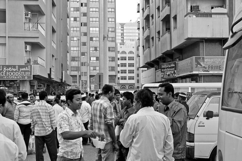 Workers gather in downtown Abu Dhabi. Courtesy Yasser Elsheshtawy