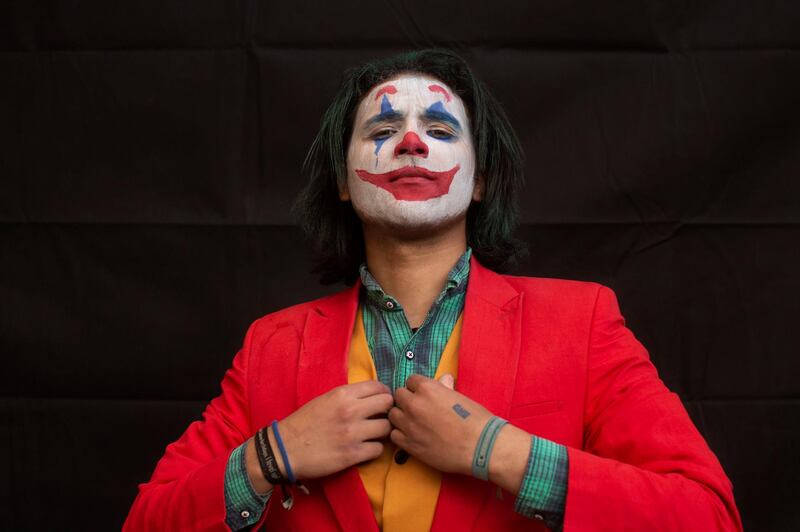 Mosa DaVinci, 25, poses for a portrait dressed as The Joker at EgyCon, an annual gathering for comic book enthusiasts, in Cairo, Egypt. AP Photo