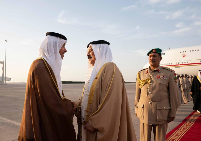 ABU DHABI, UNITED ARAB EMIRATES - May 23, 2019: HH Sheikh Hazza bin Zayed Al Nahyan, Vice Chairman of the Abu Dhabi Executive Council (L), greets HM King Hamad bin Isa Al Khalifa, King of Bahrain (C), at Al Bateen Airport. 

( Mohamed Al Hammadi / Ministry of Presidential Affairs )
---