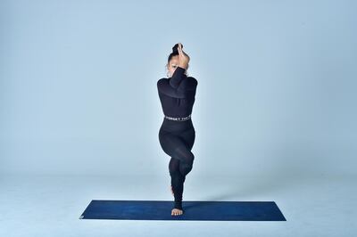 Eagle pose improves concentration and relieves anxiety. Photo courtesy Nerry Toledo