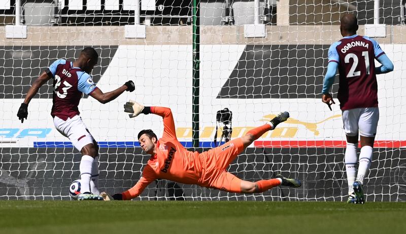 West Ham's Issa Diop, left, scores an own goal at St James' Park. AP