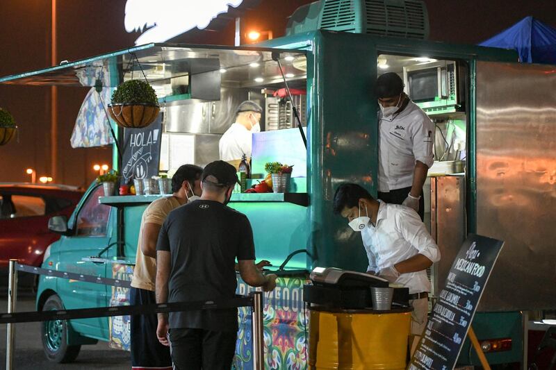 Drive-in Match Screening-AD Food trucks serving food during the outdoor screening at Zayed Sports complex in Abu Dhabi on May 29, 2021. Khushnum Bhandari / The National 
Reporter: N/A Sports
