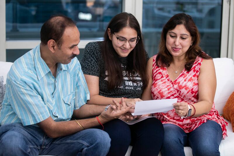 Akshara with her parents Rajeev and Shobhana Thakur at her home in Dubai.  