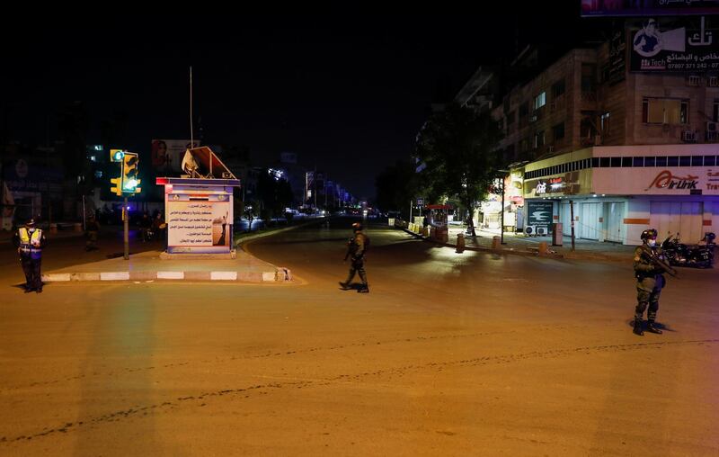 Iraqi security forces patrol the streets during a curfew, which was imposed to prevent the spread of the coronavirus disease (COVID-19), in Baghdad, Iraq. REUTERS