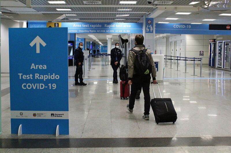 Departing passengers walk at the International Airport 'Leonardo Da Vinci' in Fiumicino, near Rome. EPA