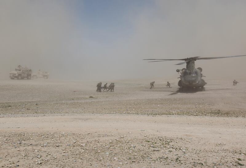 A CH47 "Casevac" helicopter with surgical team onbard lands to evacuate the wounded.
UAE Special Forces on patrol in Afghanistan with American Special Forces (Green Berets) and Afghan Commandos (ANA). 
Online photo credit must read: Copyright Alex Gardiner /  alex@whowearswins.com

-- EXCLUSIVE IMAGES - OK FOR ONLINE WITH CREDIT AS ABOVE, NO ARCHIVE NO FURTHER USE NO DISTRIBUTION - CONTACT BRIAN BEFORE TOUCHING --