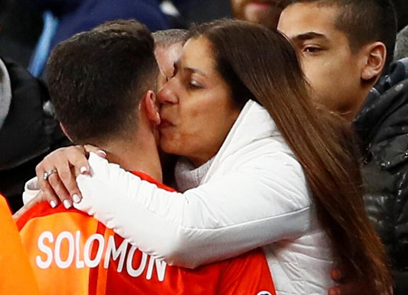 Shakhtar Donetsk's Manor Solomon celebrates with a fan after the match. Reuters