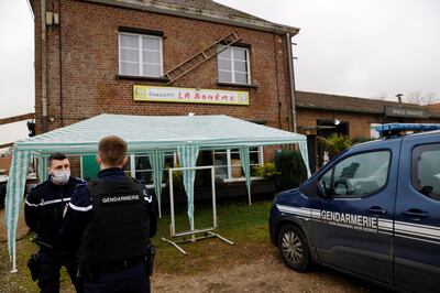 French gendarmes stand outside the "La Boheme" bar restaurant in Ligescourt which owner Kathia Boucher has opened as an act of civil disobedience in protest against the government-ordered coronavirus closure of bars and restaurants in France, February 1, 2021. REUTERS/Pascal Rossignol