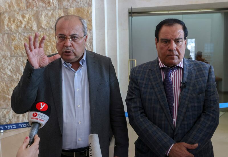 Dr Abuelaish and Arab-Israeli Member of Parliament Ahmed Tibi, left, speak to journalists at the Israeli Supreme Court. AFP
