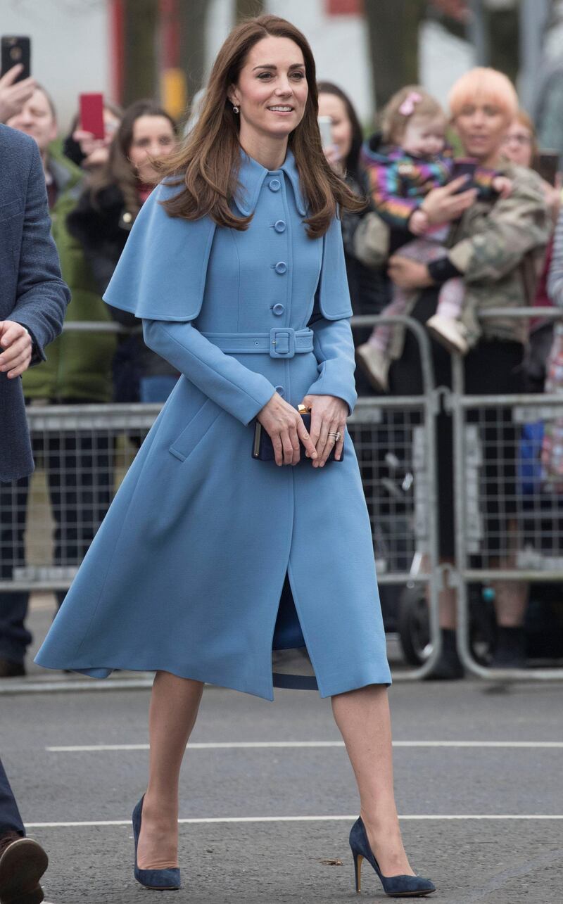 The Duchess of Cambridge wears a powder blue Mulberry coat for her second day in Northern Ireland. The coat was worn with Rupert Sanderson Malory pumps, a Jimmy Choo clutch and diamond and sapphire earrings. Reuters