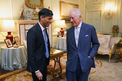 Britain's King Charles III speaks with Prime Minister Rishi Sunak at Buckingham Palace. AFP