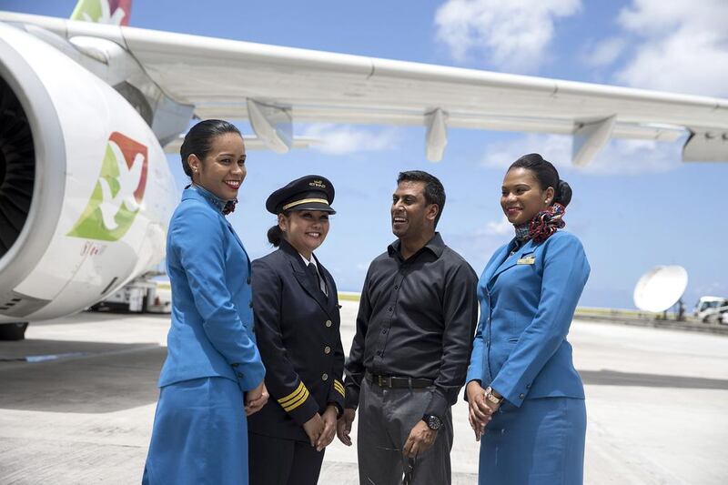 Air Seychelles CEO, Manoj Papa, poses for a picture with some of the company's staff at Victoria airport. France is the No 1 market for tourism in Seychelles. The sector contributes to no less than 60 per cent of the country’s economy. Silvia Razgova / The National